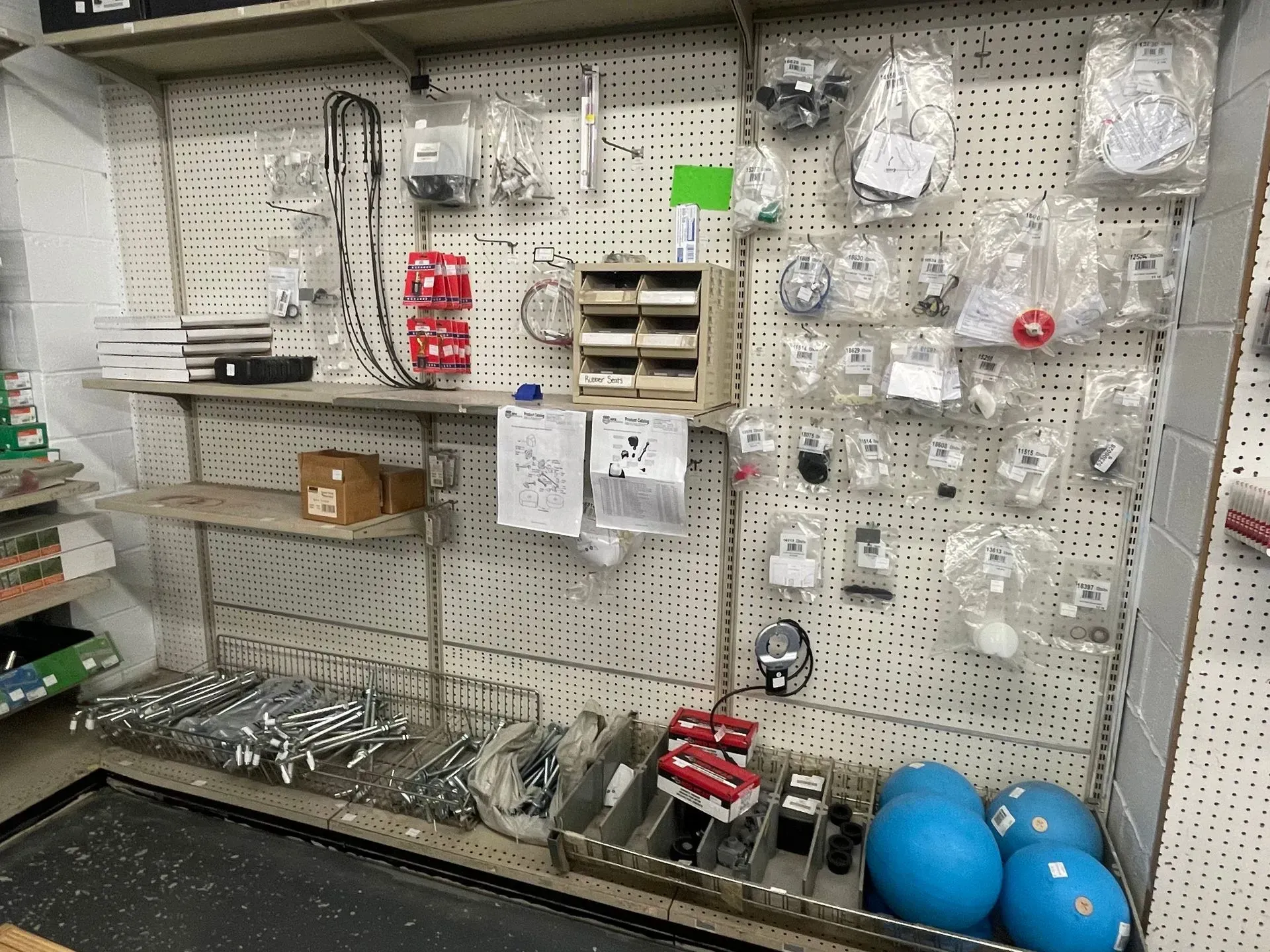A wall filled with lots of tools and supplies in a store.