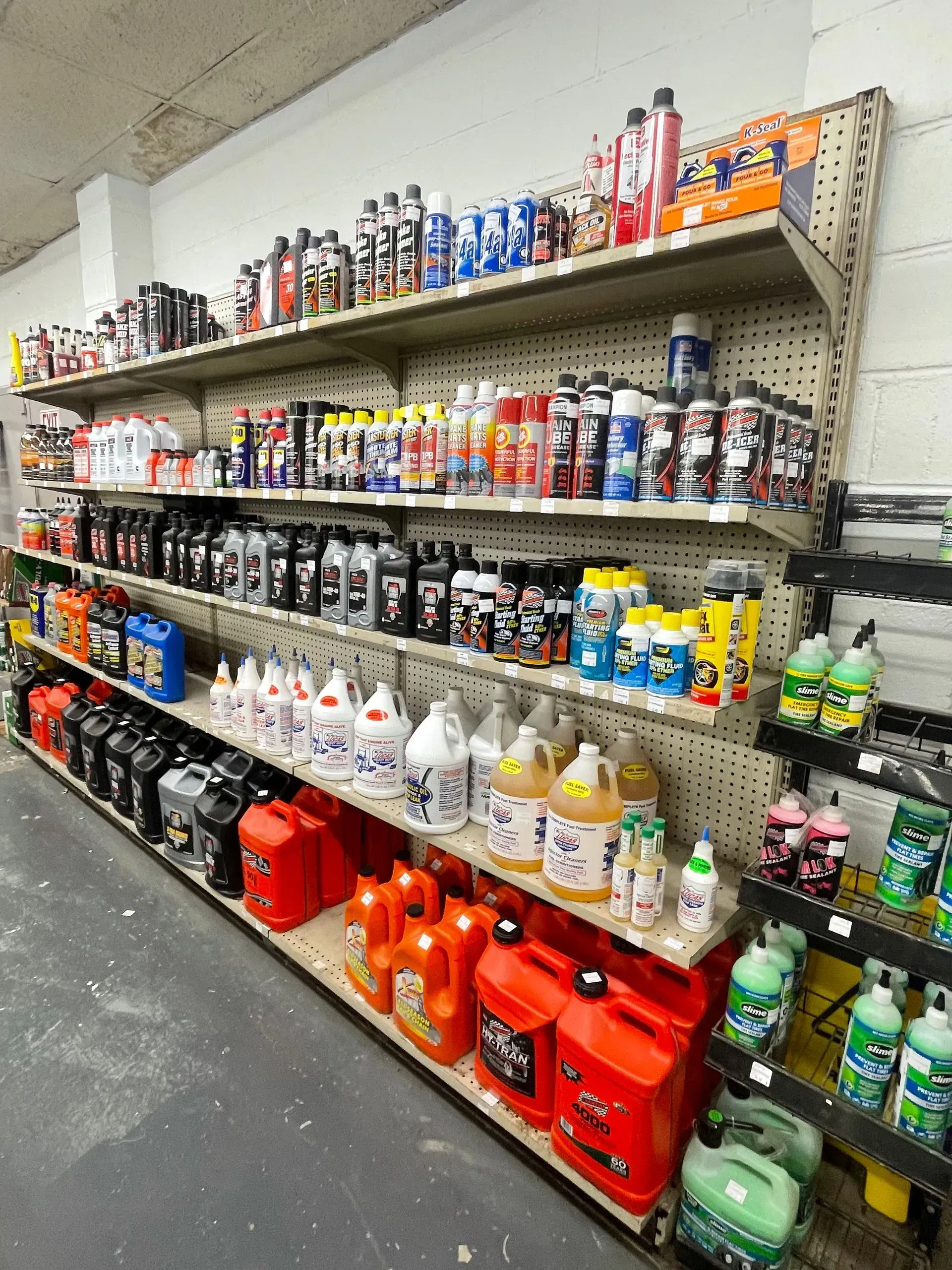 A store shelf filled with many different types of cleaning products