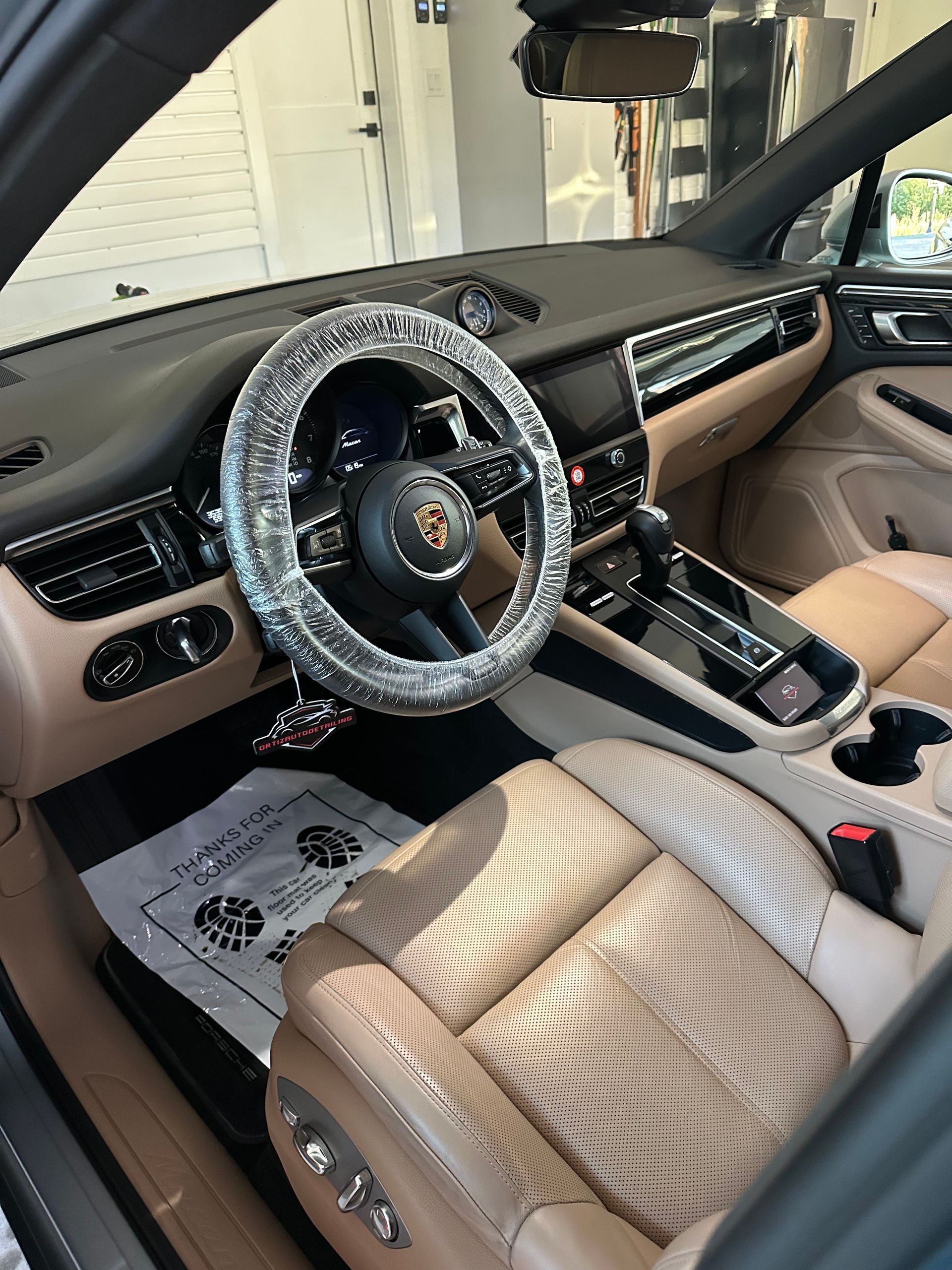 Truck cab interior with black floor mats and folded rear seating area
