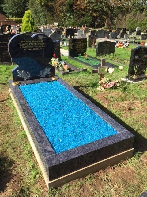 black full memorial with blue pebbles