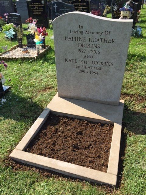gray lawn memorial with little space for planting flowers