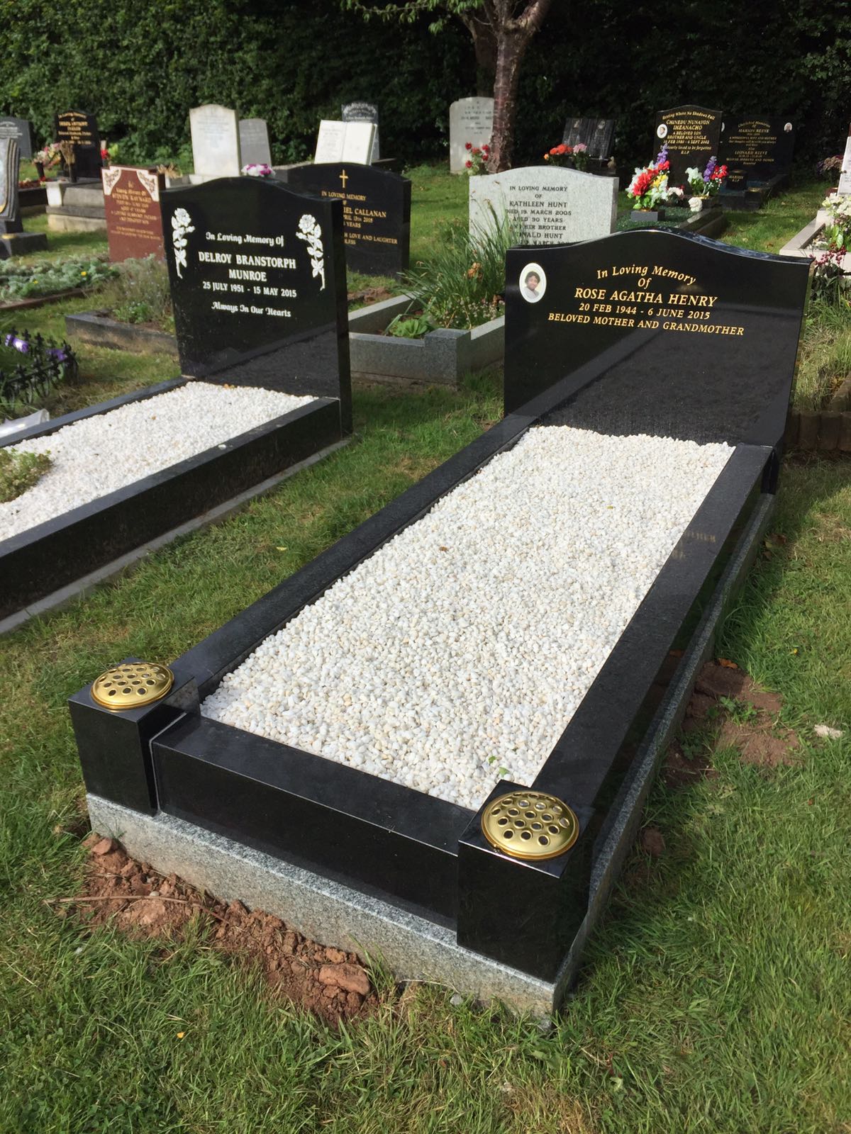 black full memorial with white pebbles