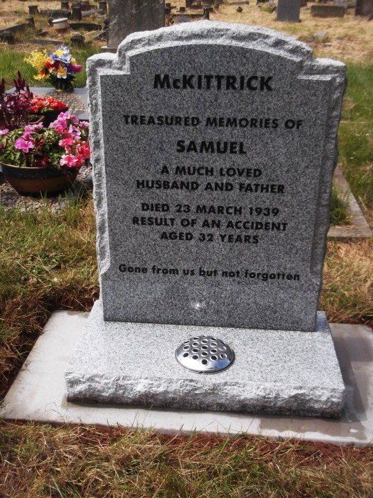 grey rough looking lawn memorial