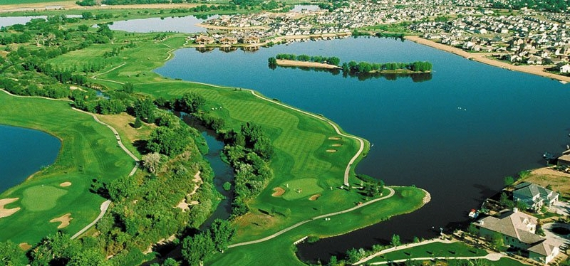 An aerial view of homes in windsor CO on a golf course