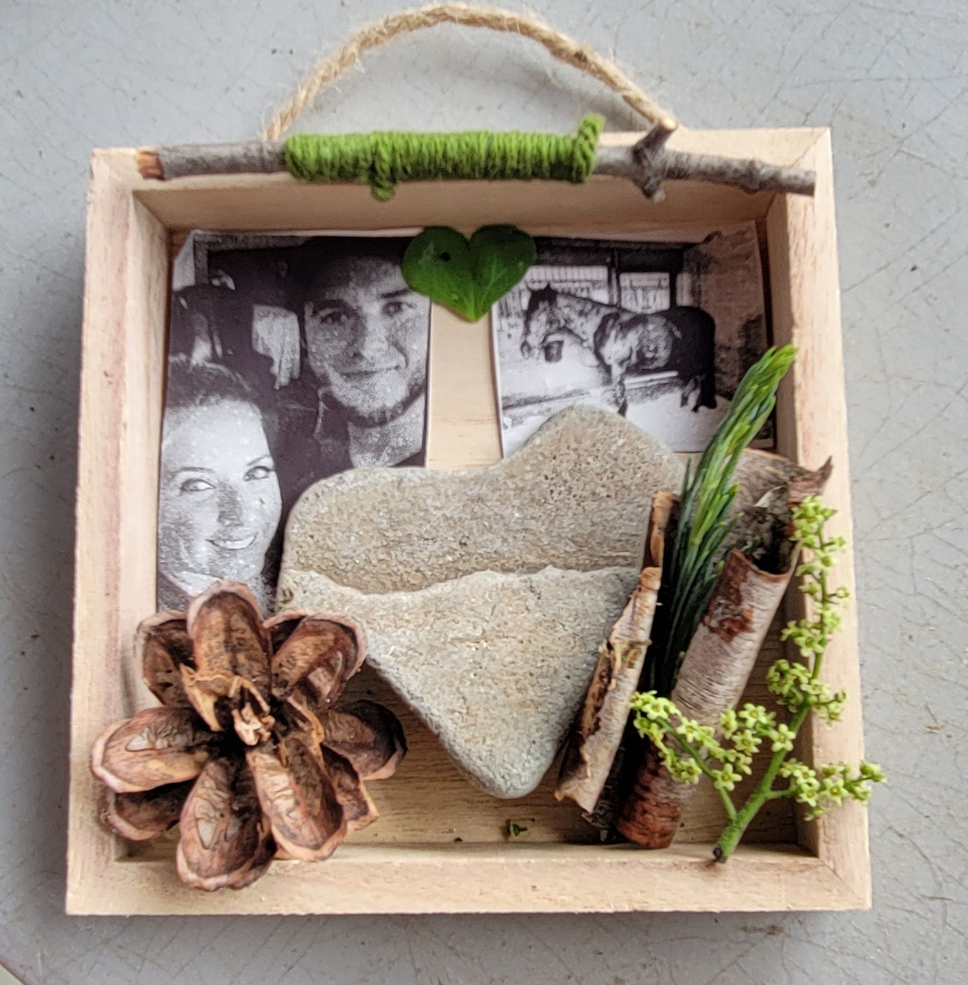 A wooden box with a picture of a man and a woman on it
