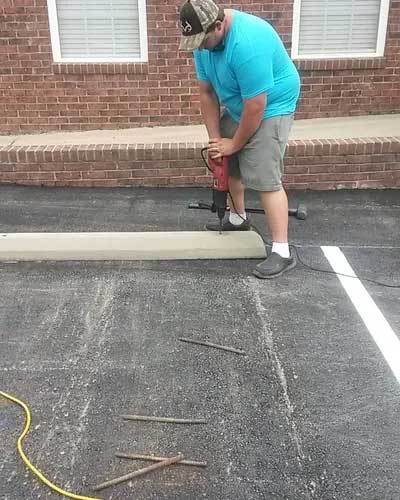 Drilling Parking Humps — Gaston, SC — Huggins Paving & Sealcoating - ABC Sealcoating & Striping
