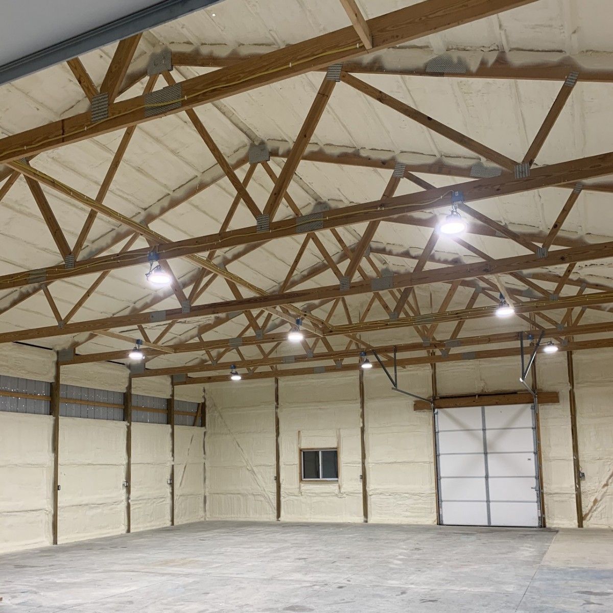 A large empty warehouse with a lot of foam on the walls and ceiling.