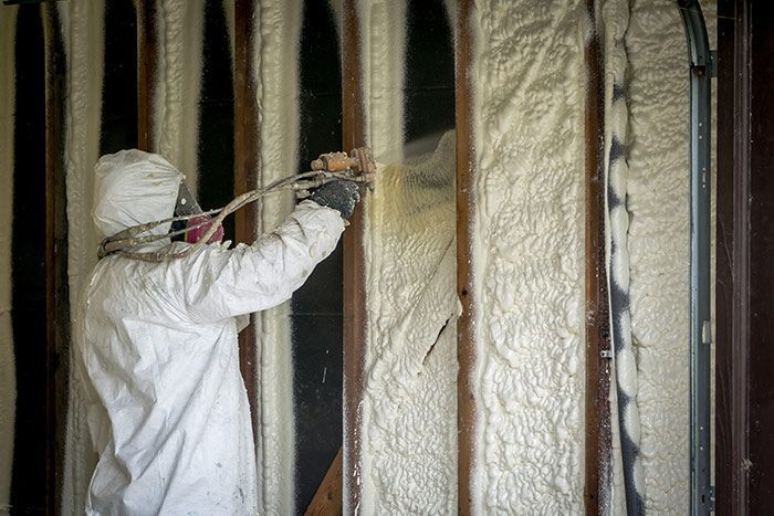 There is a lot of insulation in the attic of a house.