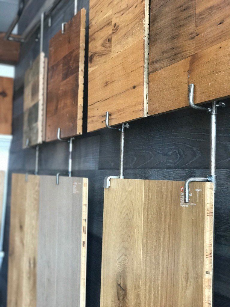 Wood Flooring Showroom— Different Types Of Woods Hanging On The Wall in Naples, FL