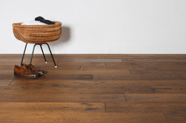 Tile And Stone Flooring —  A Piece Chair Under The Wooden Floor in Naples, FL