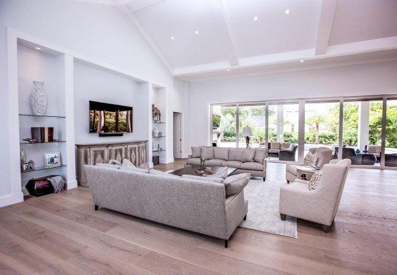 Oak Flooring — Modern Style Living Room With Hardwood Flooring in Naples, FL