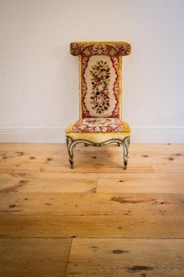 High Quality Flooring — Beautiful Sofa Chair Under The Wooden Floor in Naples, FL