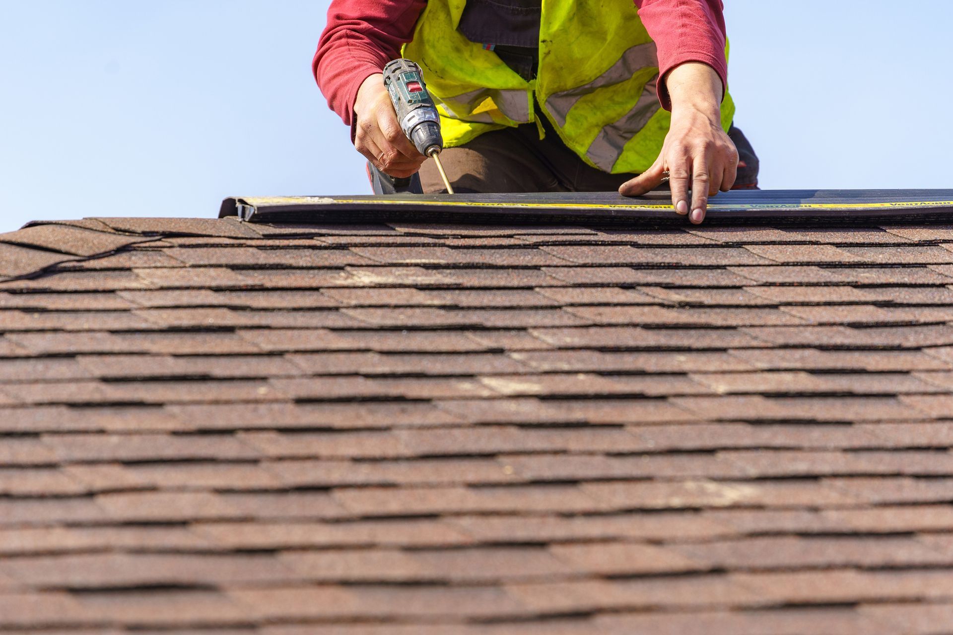 Inspector checking on the condition of a homeowner’s roof. Inspector checking on the condition of a homeowner’s roof.