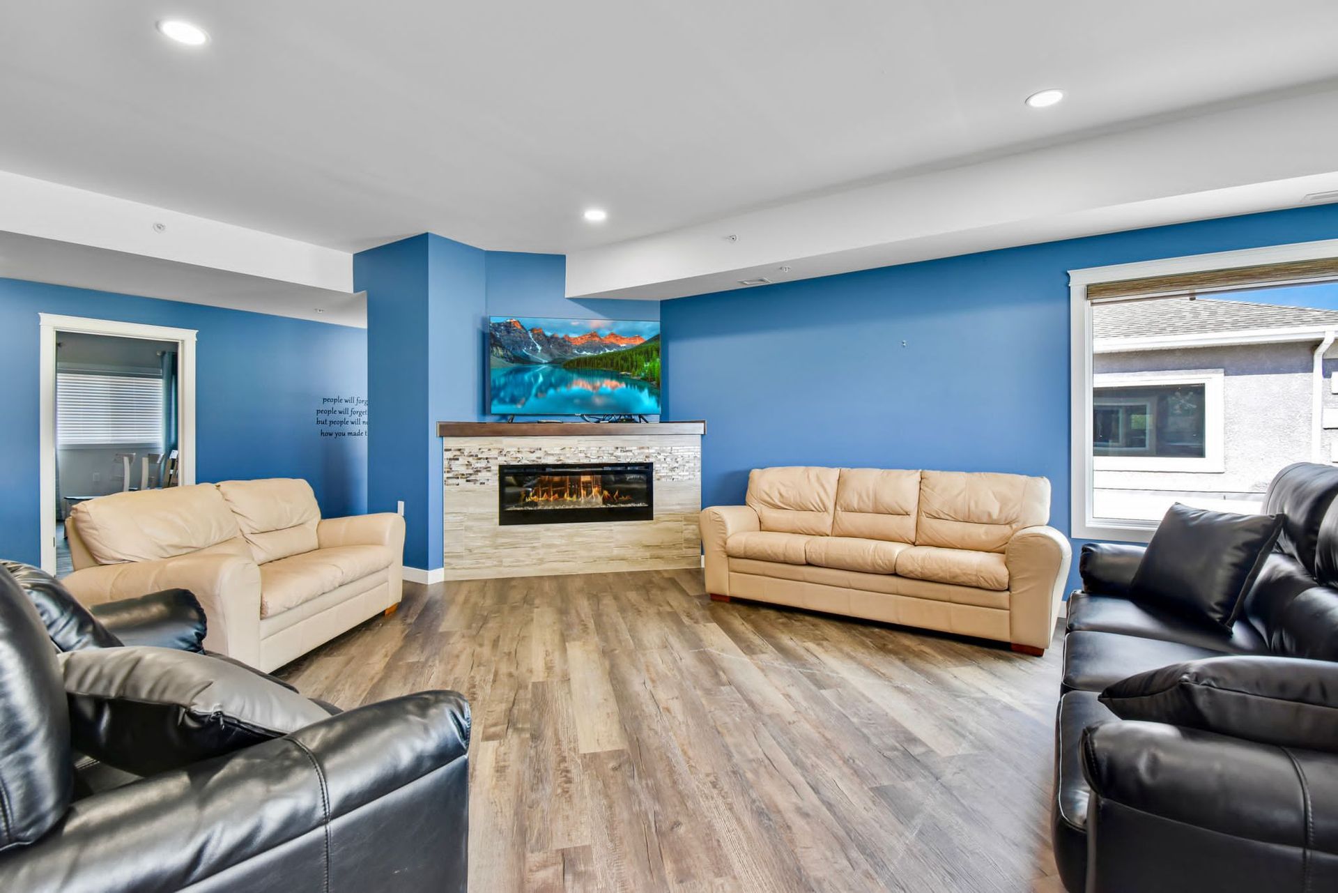 A living room filled with furniture and a fireplace.