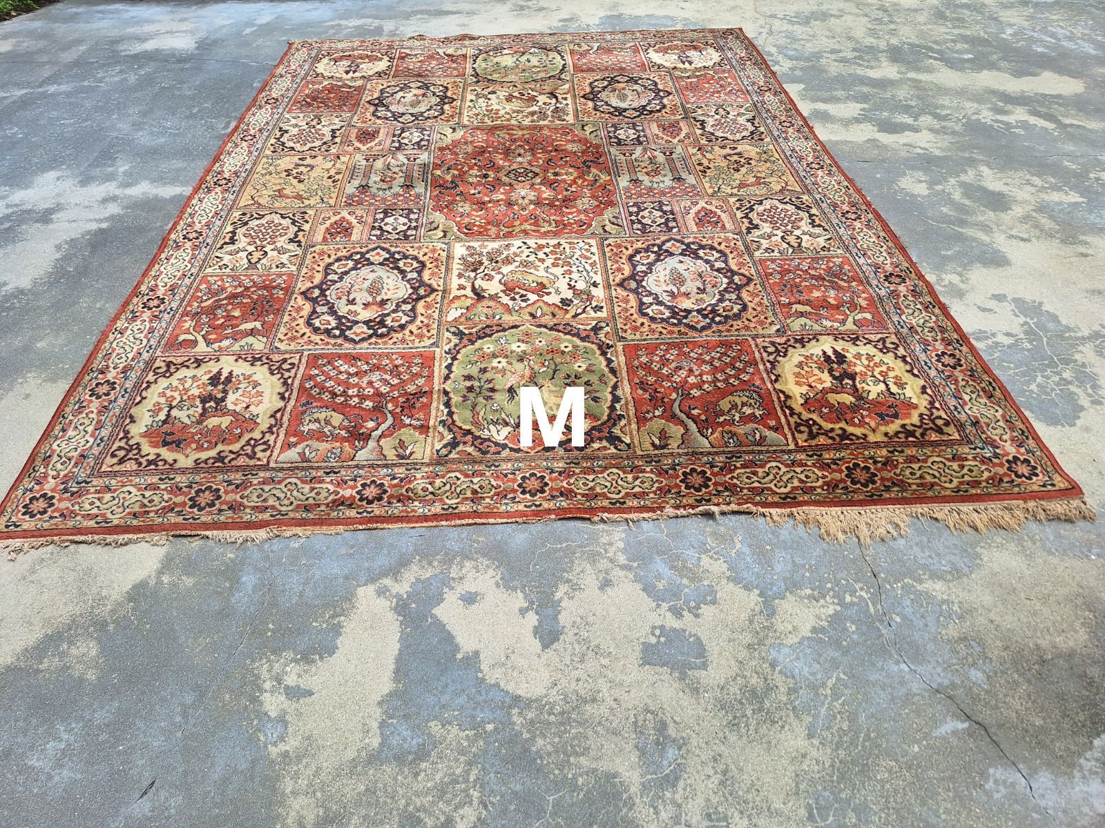A rug with the letter m on it