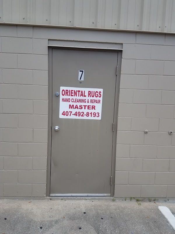 A door with a sign on it that says oriental rugs