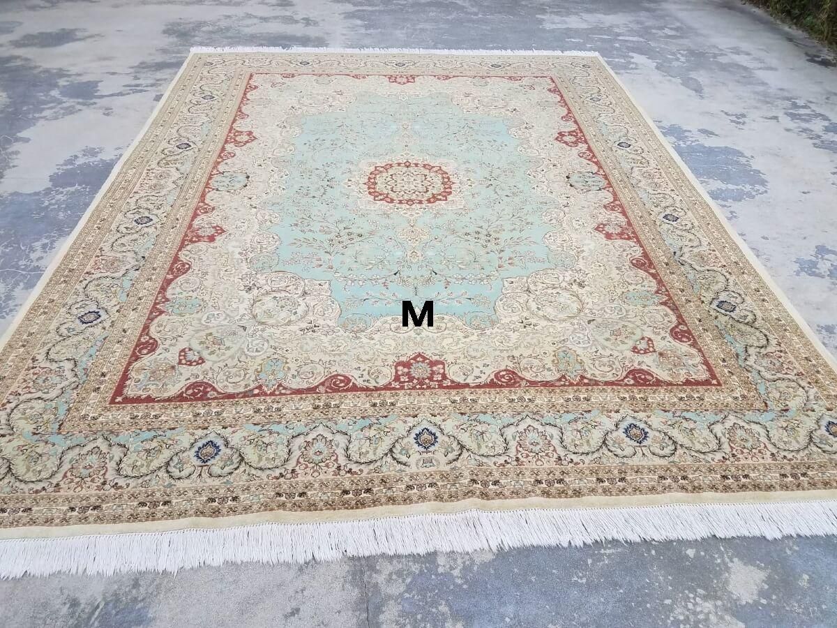 A large rug with the letter m on it
