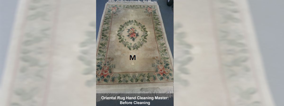 A rug with the letter m on it