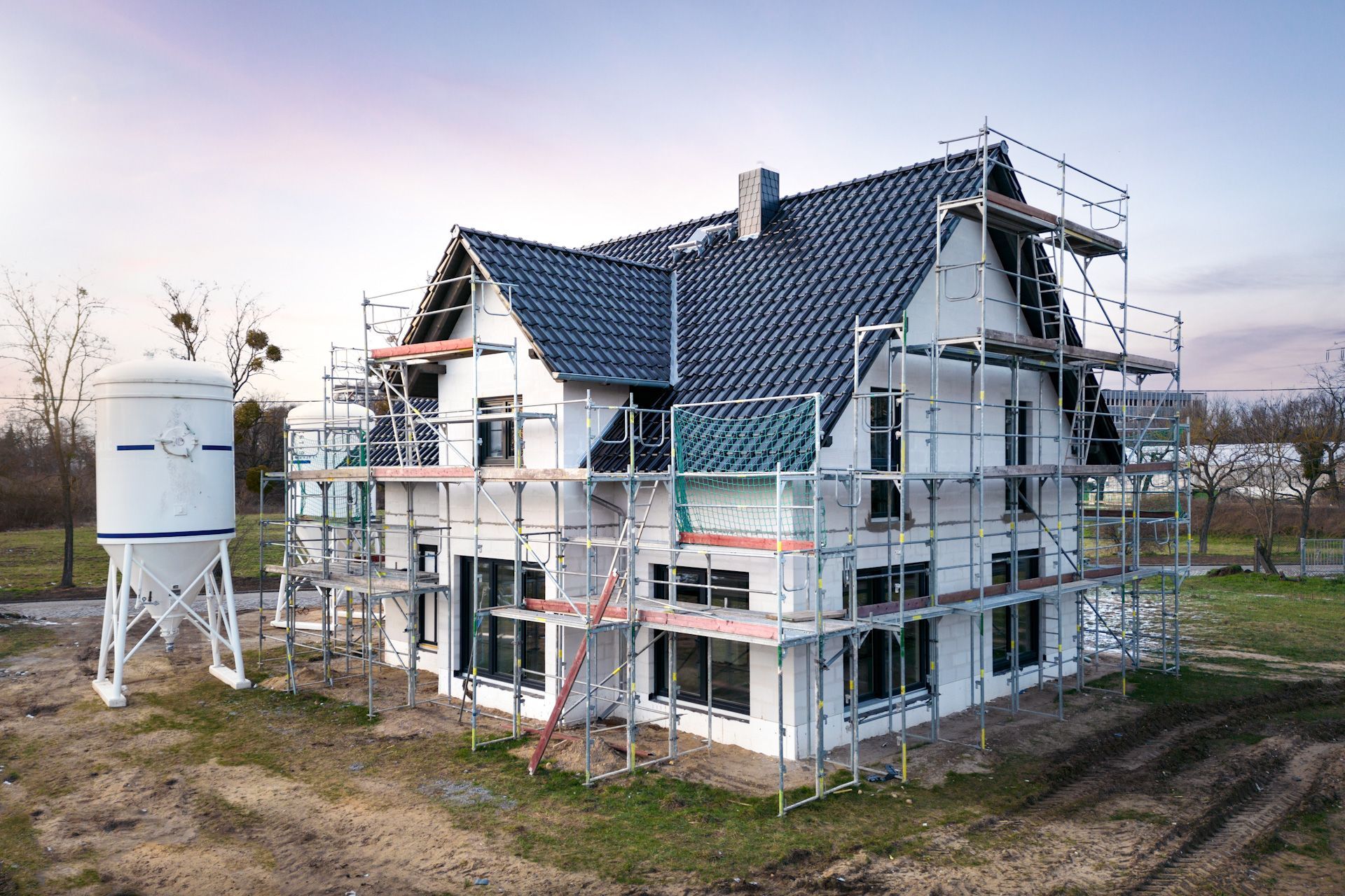 A house is being built with scaffolding around it.