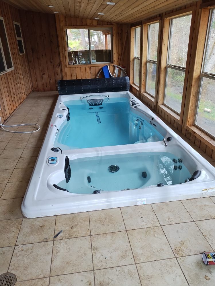 There is a large swimming pool in the middle of the room.