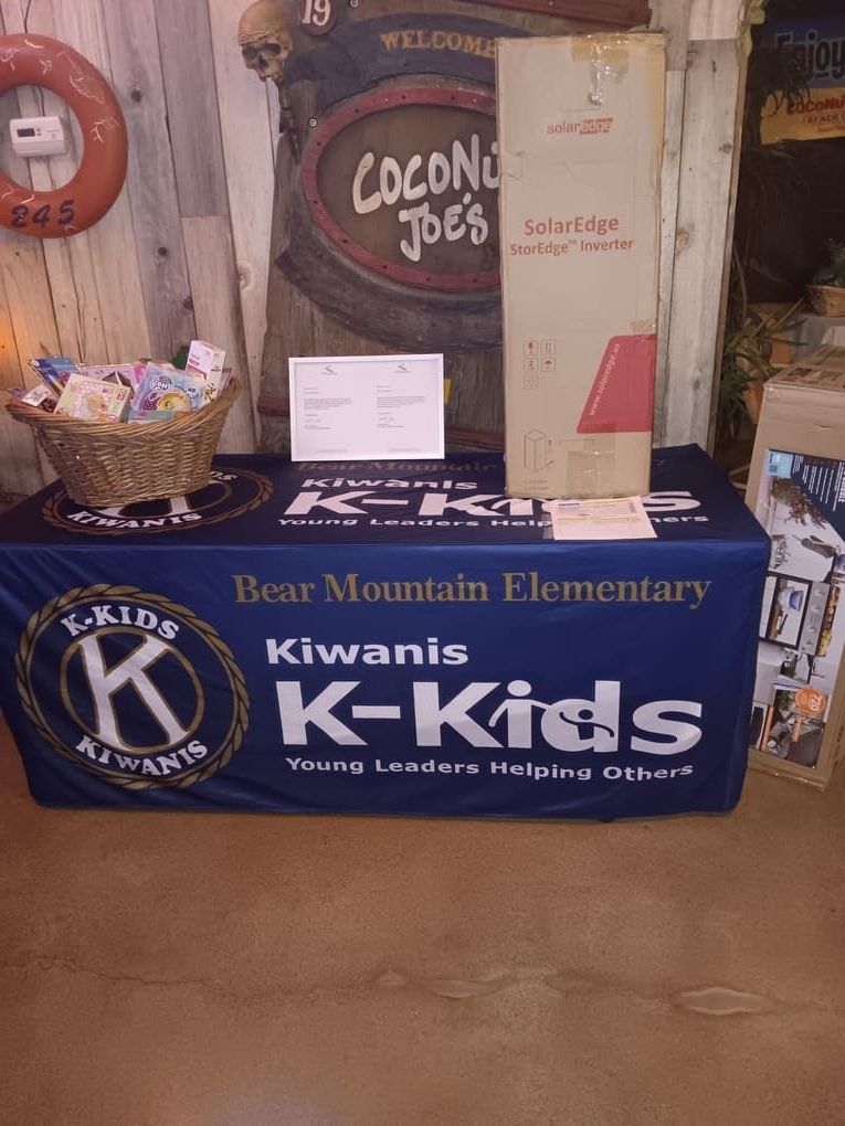 A table with a sign that says k-kids on it