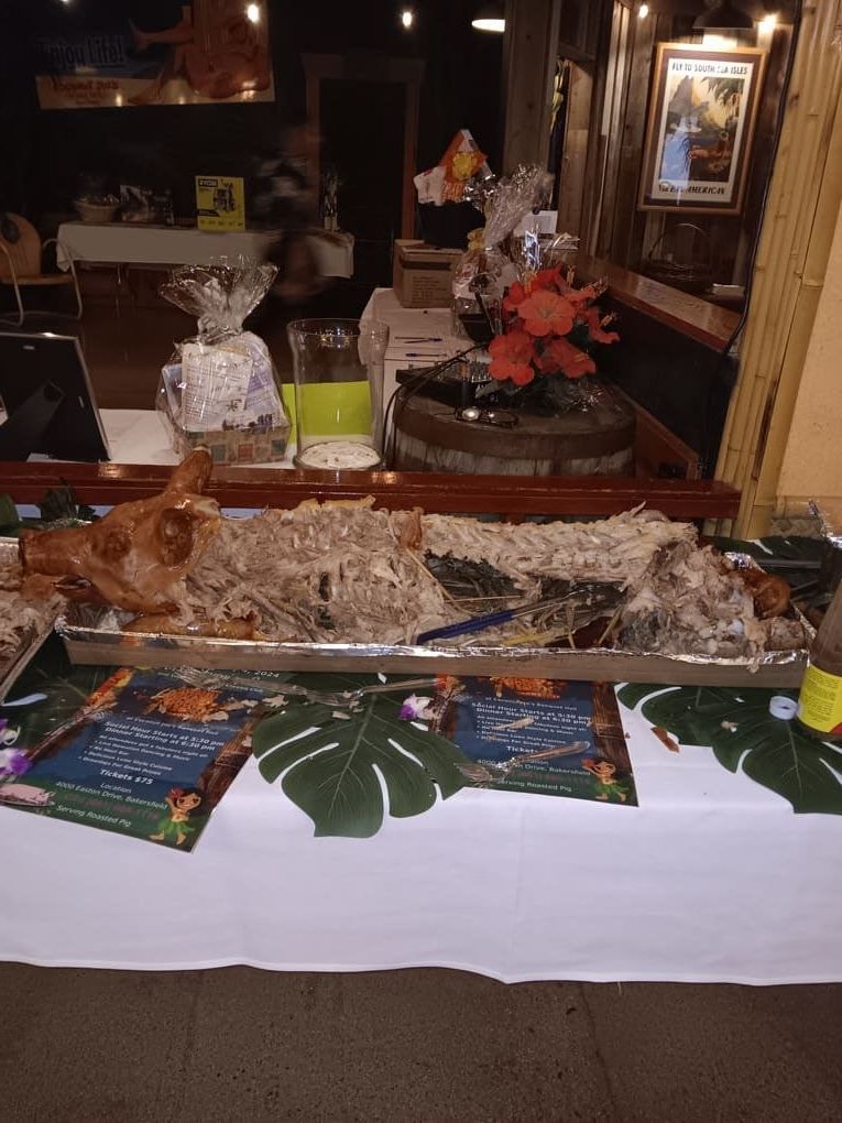 A buffet table with bones of a pig