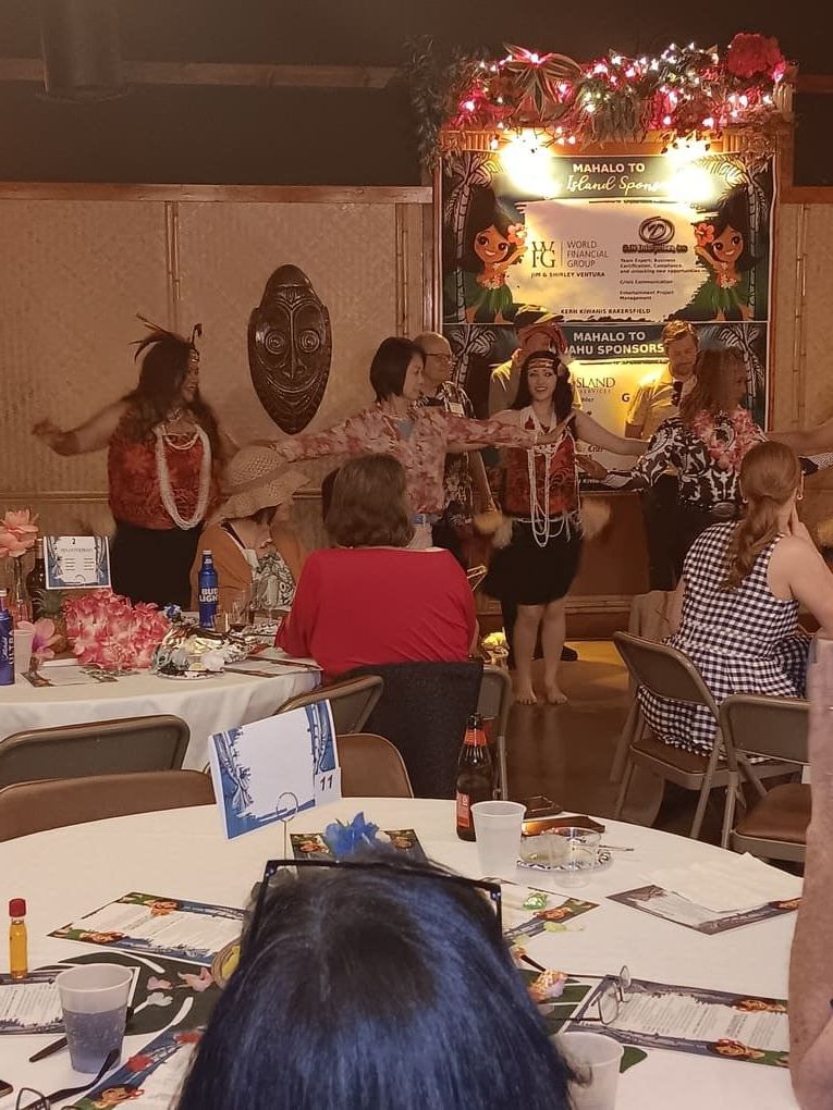 A group of people are sitting at tables in a room