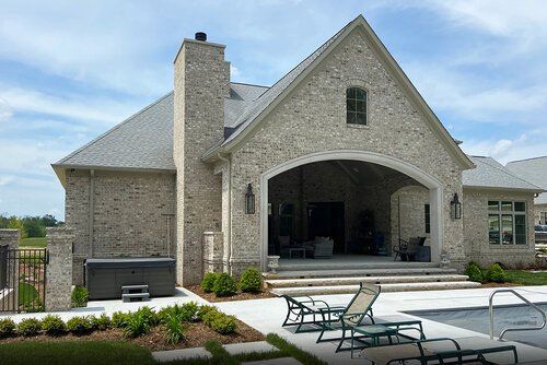 House in front of a swimming pool — Jasper, IA — Dubois Co. Block & Brick Inc.