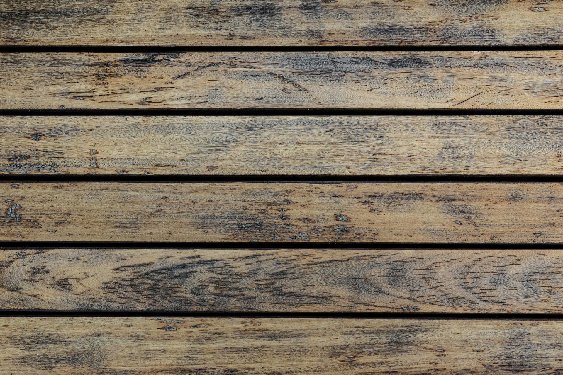 A close up of a wooden surface with a grainy texture.