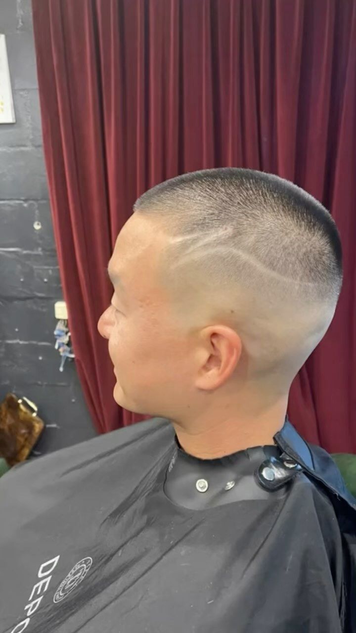 A Man is Getting His Hair Cut at a Barber Shop — Connolly & Co Barbers In Robina, QLD