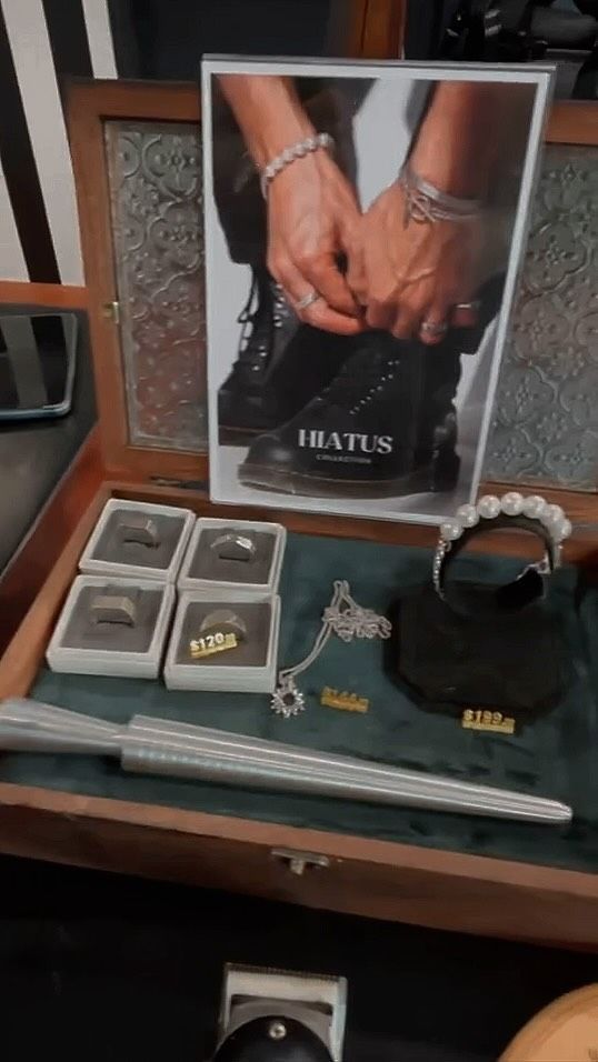 A Wooden Box Filled With Jewelry and a Picture of a Person Tying Their Shoe — Connolly & Co Barbers In Robina, QLD