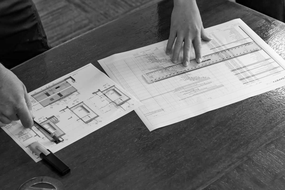 Building Design Consideration for better ROI - project managers discussing height safety systems design