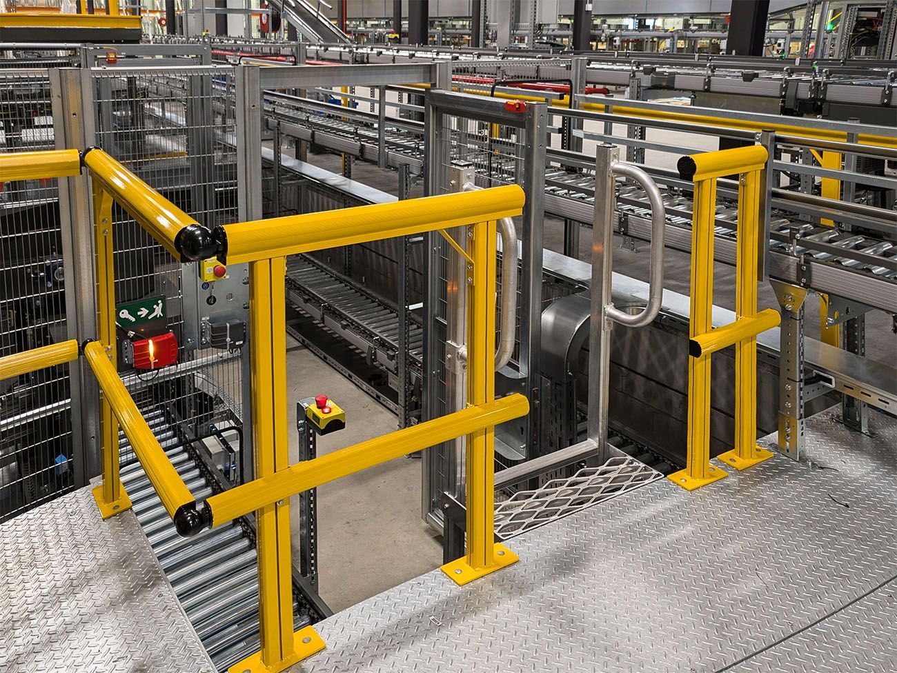 Permanent Conveyor Edge Protection System - Yellow Guardrails inside the distribution centre
