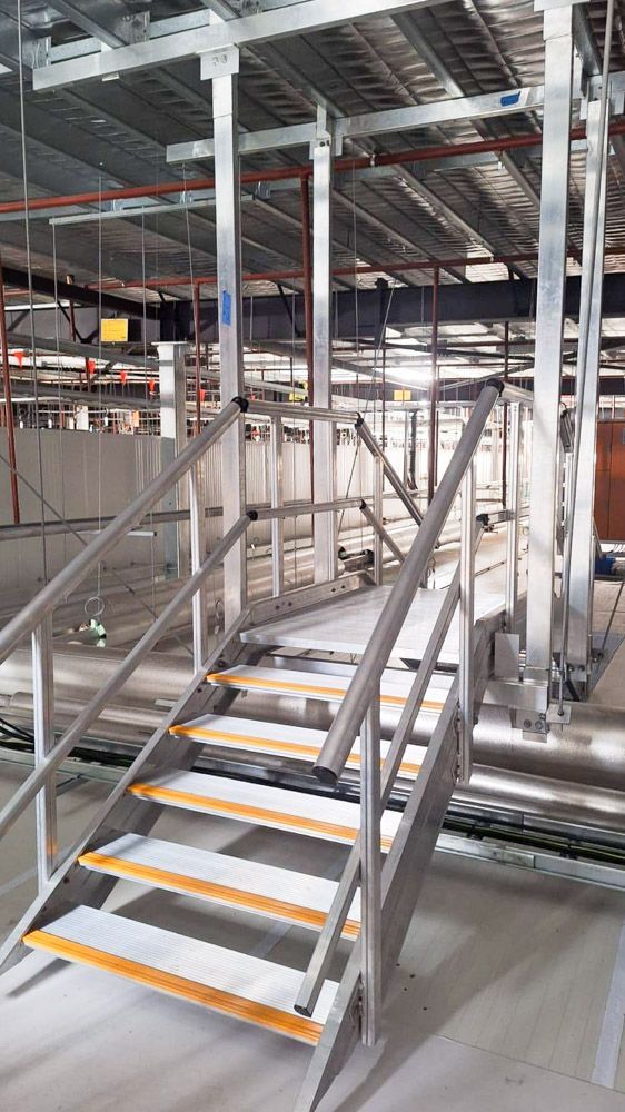 Engineered stairs above the insulated panels in the cold storage