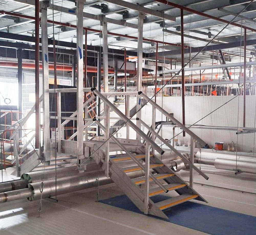 Suspended Crossover Stairs inside the ceiling cavity in the cold storage facility