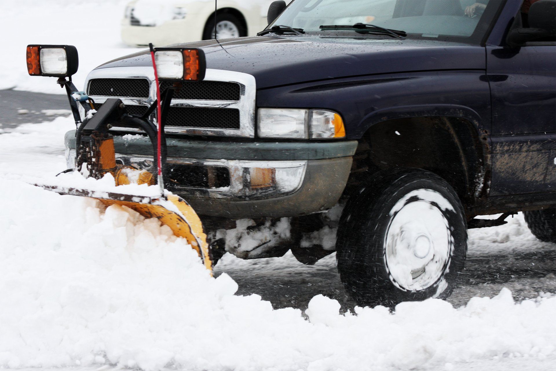 Man using snowblower in deep snow