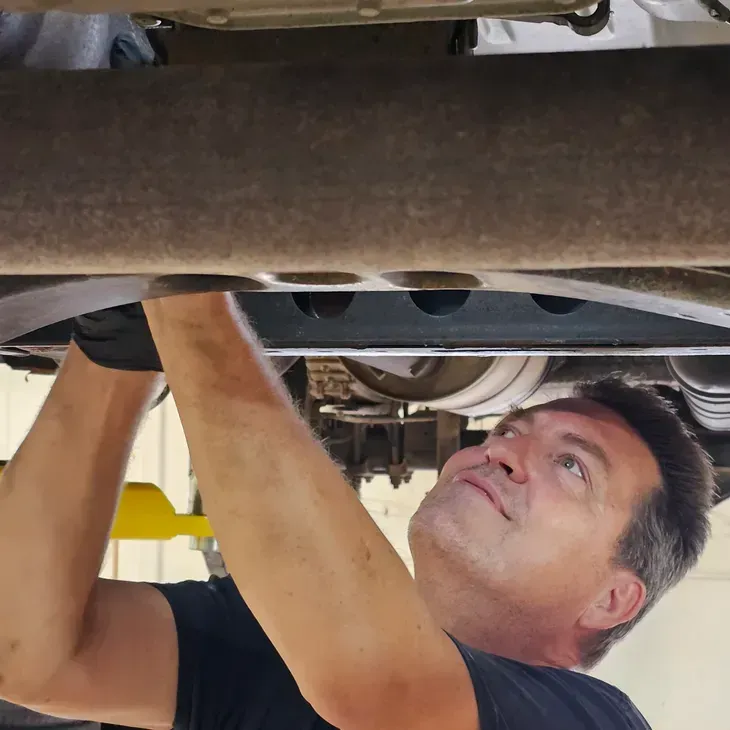 Mechanic under vehicle