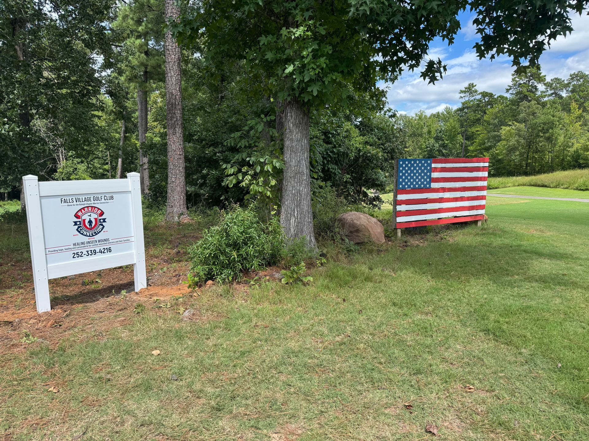 A man in a suit and tie is smiling for the camera.