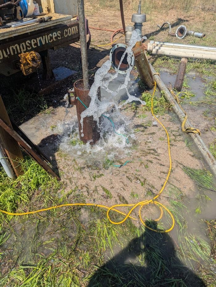 Blue industrial pump with pipes, fittings, and a flexible joint. Blue industrial pump with pipes, fittings, and a flexible joint.