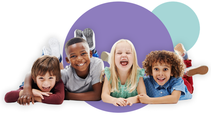 Four smiling children lying on the floor in front of overlapping purple and teal circles