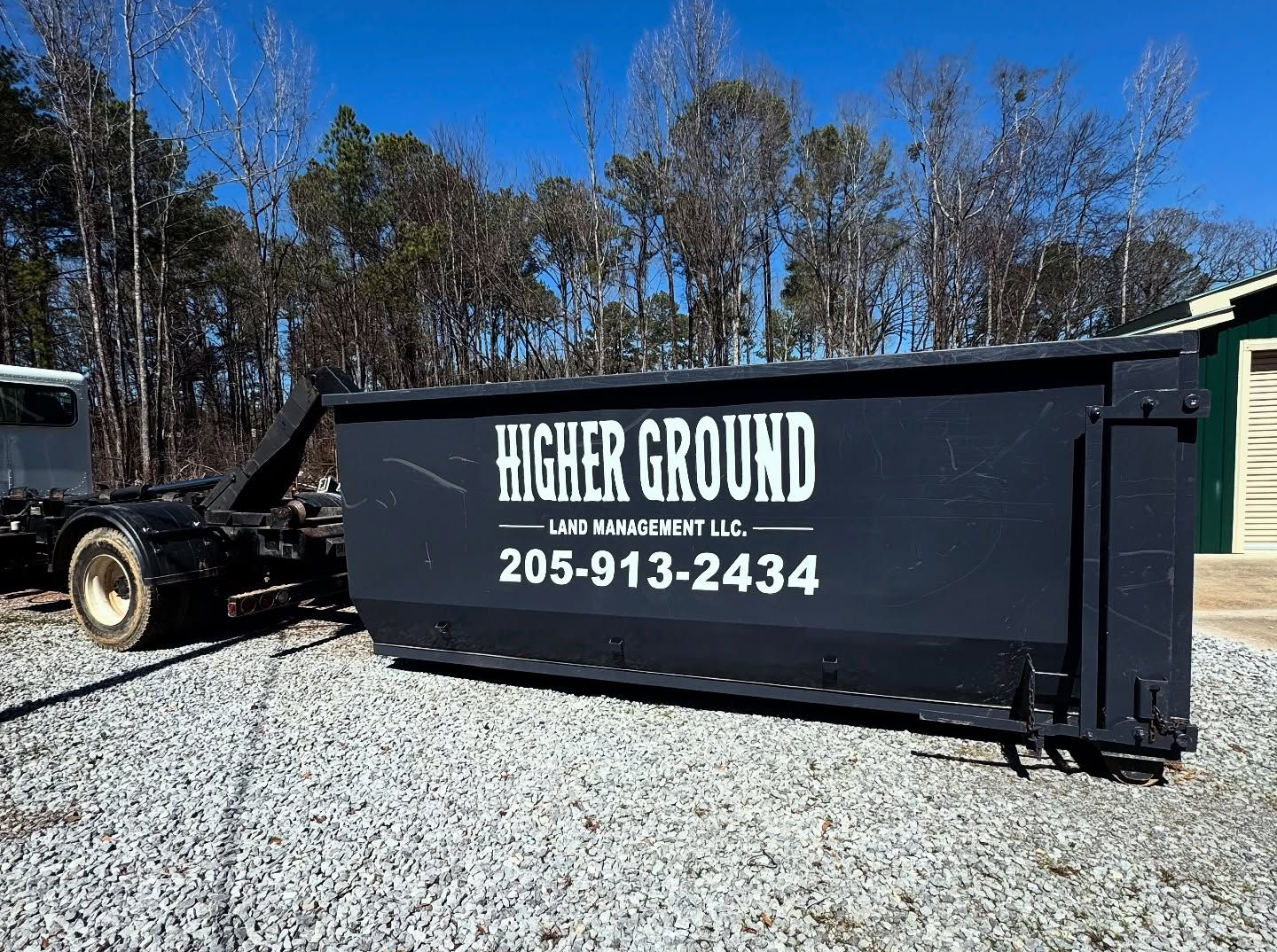 Newly poured concrete driveway with a worker using equipment.