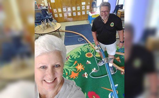 Senior People Happily Cleaning The Carpet — St. John’s, MI — Clover Carpet Cleaning