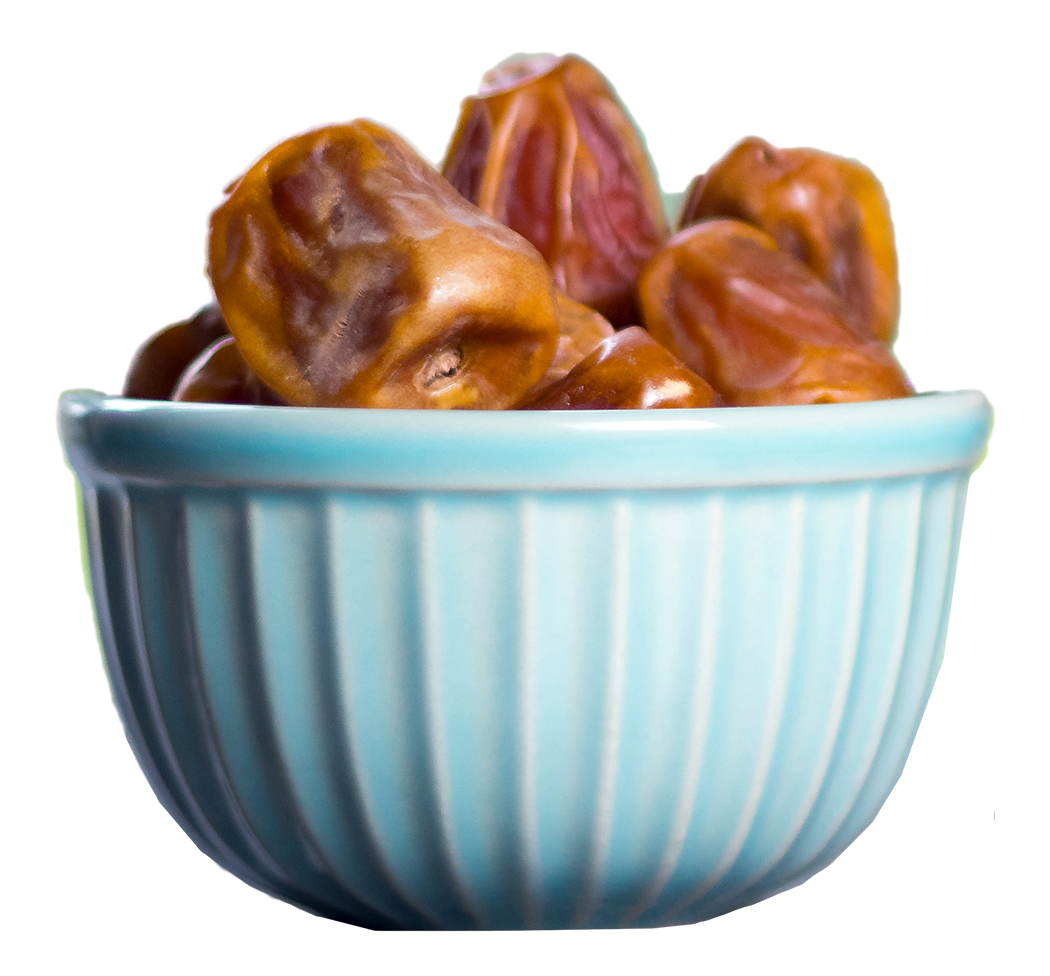 A blue bowl filled with dates on a white background