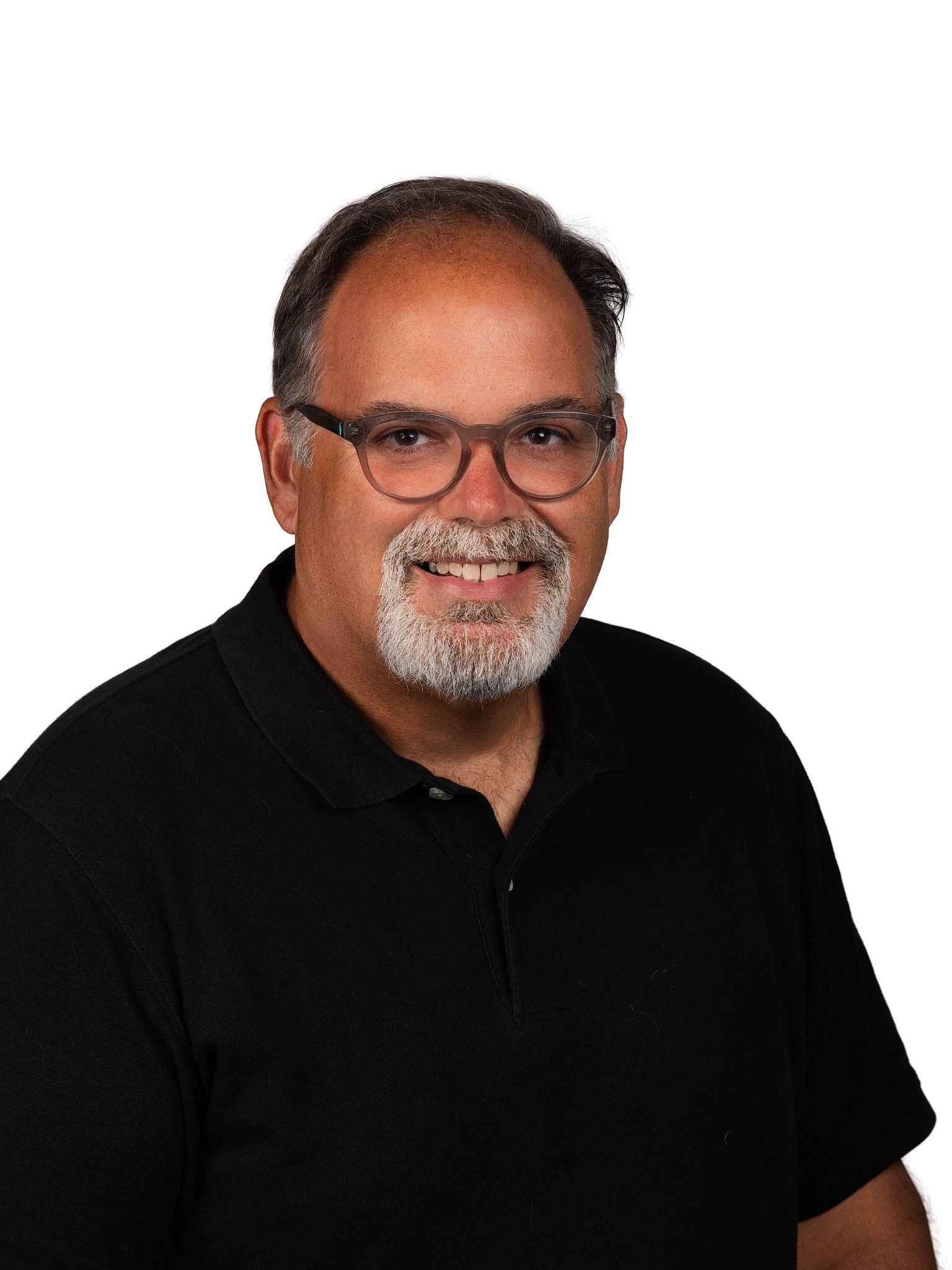 A headshot of someone called Petrut Bambanac. He is standing against a purple wall