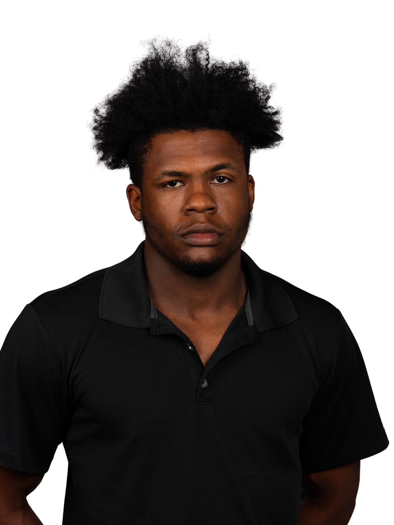 A headshot of someone called Petrut Bambanac. He is standing against a purple wall