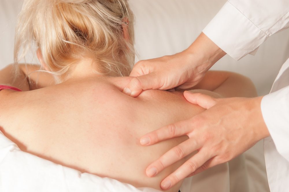 A Woman Is Getting A Massage On Her Back — Hands on Healing Massage In Tamworth, NSW