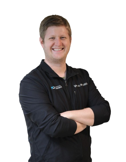 Dr. Tyler Bond Standing and Smiling