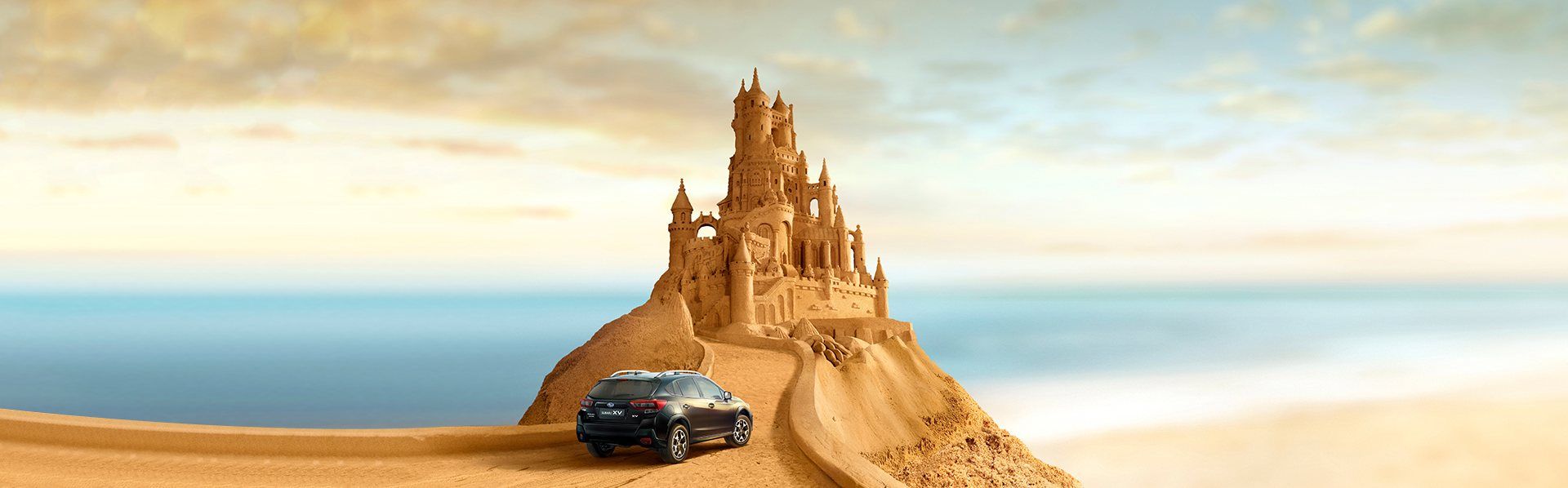 Subaru e castello di sabbia