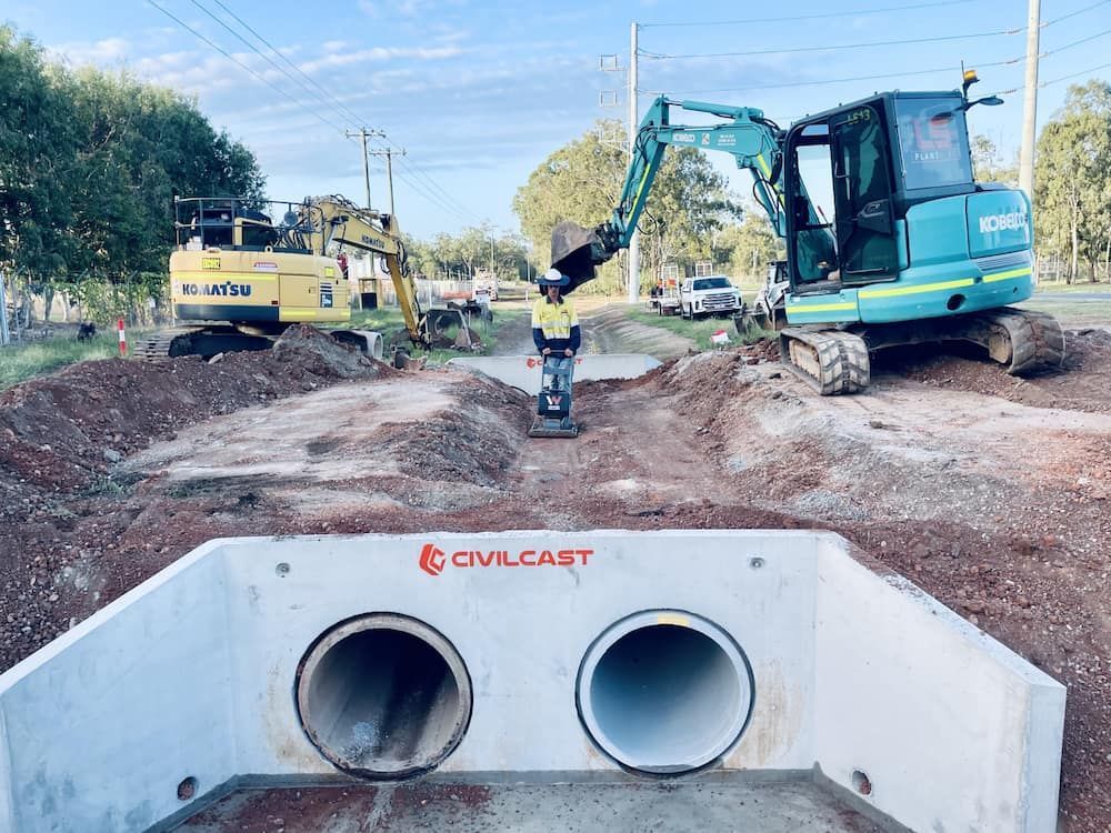 Construction Site With Two Excavators and a Culvert — LS Plant Hire in Calliope, QLD