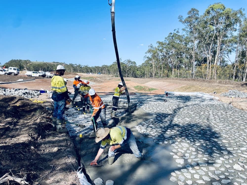 Construction Workers Pouring Concrete on a Site — LS Plant Hire in Calliope, QLD